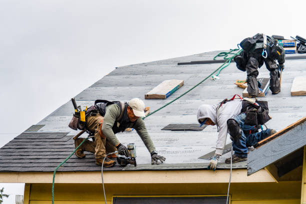Professional Roofing technician working in Milton, VT